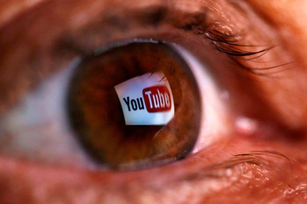 PROD-FILE-PHOTO-A-picture-illustration-shows-a-YouTube-logo-reflected-in-a-persons-eye.jpg